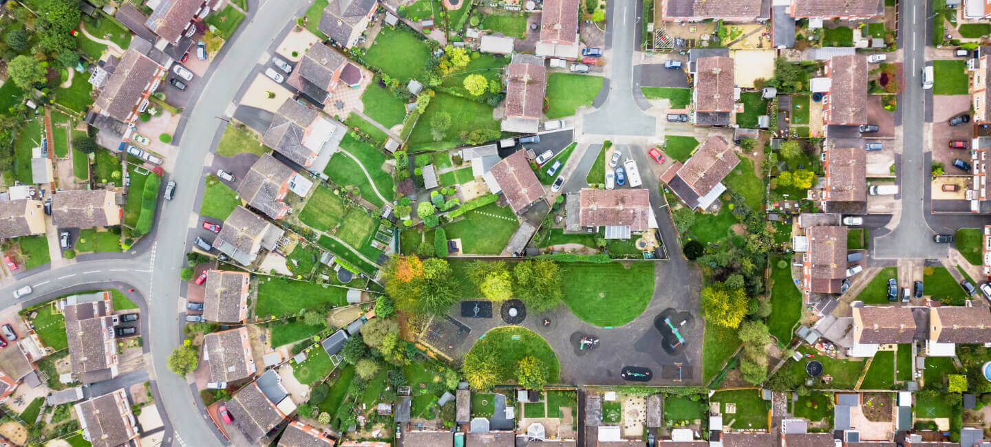 A motivated group engaged in leaflet distribution Hampshire, handing out vibrant pamphlets to passersby. The backdrop of the image captures Hampshire's picturesque landscapes and quaint towns, offering a charming rural setting for this local marketing initiative.